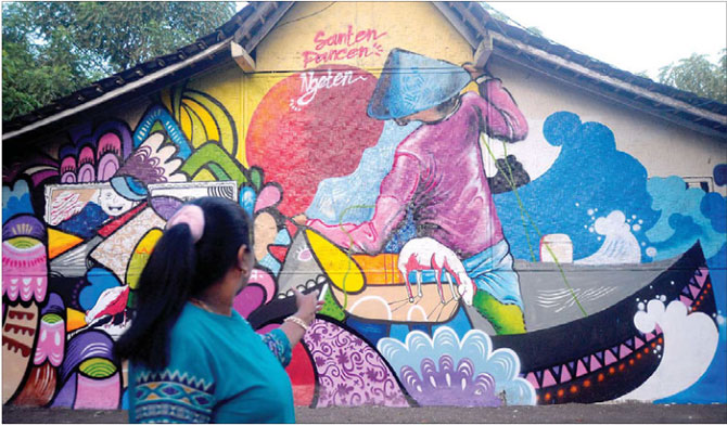 Gambar-Mural-pada-dinding-rumah-warga-pulau-santen,-lingkungan-Karanganom,-Kelurahan-Karangrejo