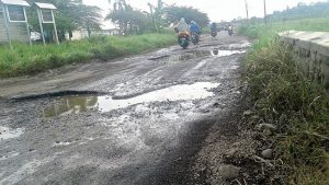 Careful! Potholes Are Everywhere